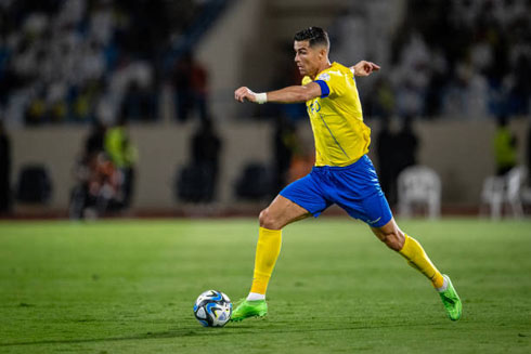 Cristiano Ronaldo running with the ball close to his boot