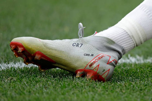 Cristiano Ronaldo and the CR7 Nike Mercurial boots in grey color