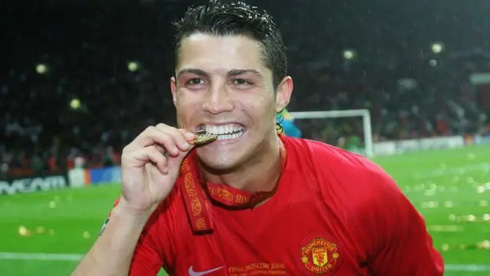 Cristiano Ronaldo biting his champions league medal for Manchester United