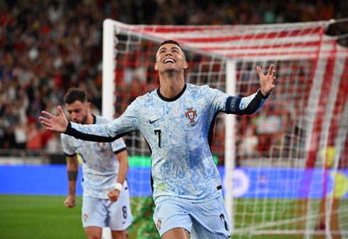 Cristiano Ronaldo after scoring for Portugal in a white shirt