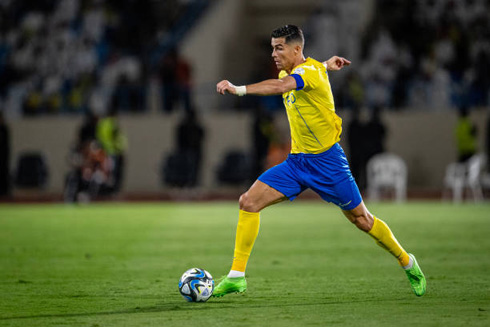 Cristiano Ronaldo racing with the ball close to his foot