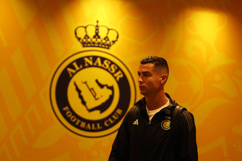 Cristiano Ronaldo walking by Al Nassr logo