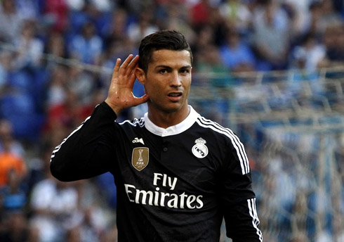 Cristiano Ronaldo wearing a Real Madrid black shirt