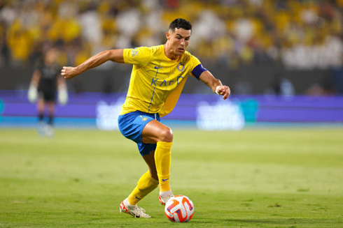 Cristiano Ronaldo running with the ball close to his boot