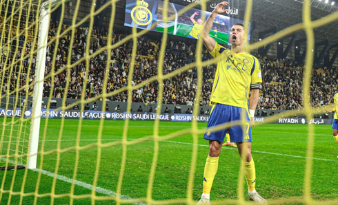 Cristiano Ronaldo celebrating goal next to the goal net