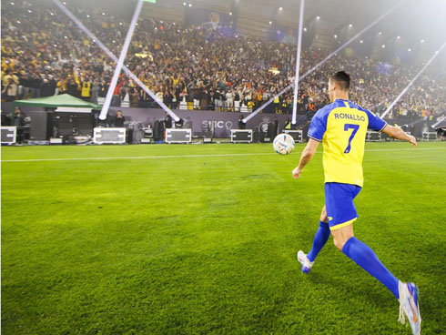 Cristiano Ronaldo kicking the ball to the fans