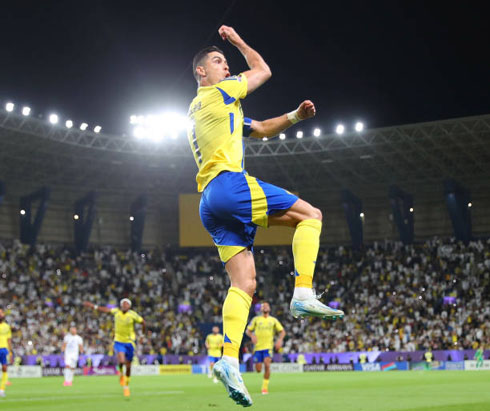 Cristiano Ronaldo celebrating goal jumping in the air